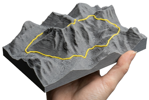 Physical 3D printed topographical relief model of a real-world landscape exported as an STL file from the 3D Map Generator.