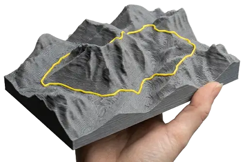 Physical 3D printed topographical relief model of a real-world landscape exported as an STL file from the 3D Map Generator.
